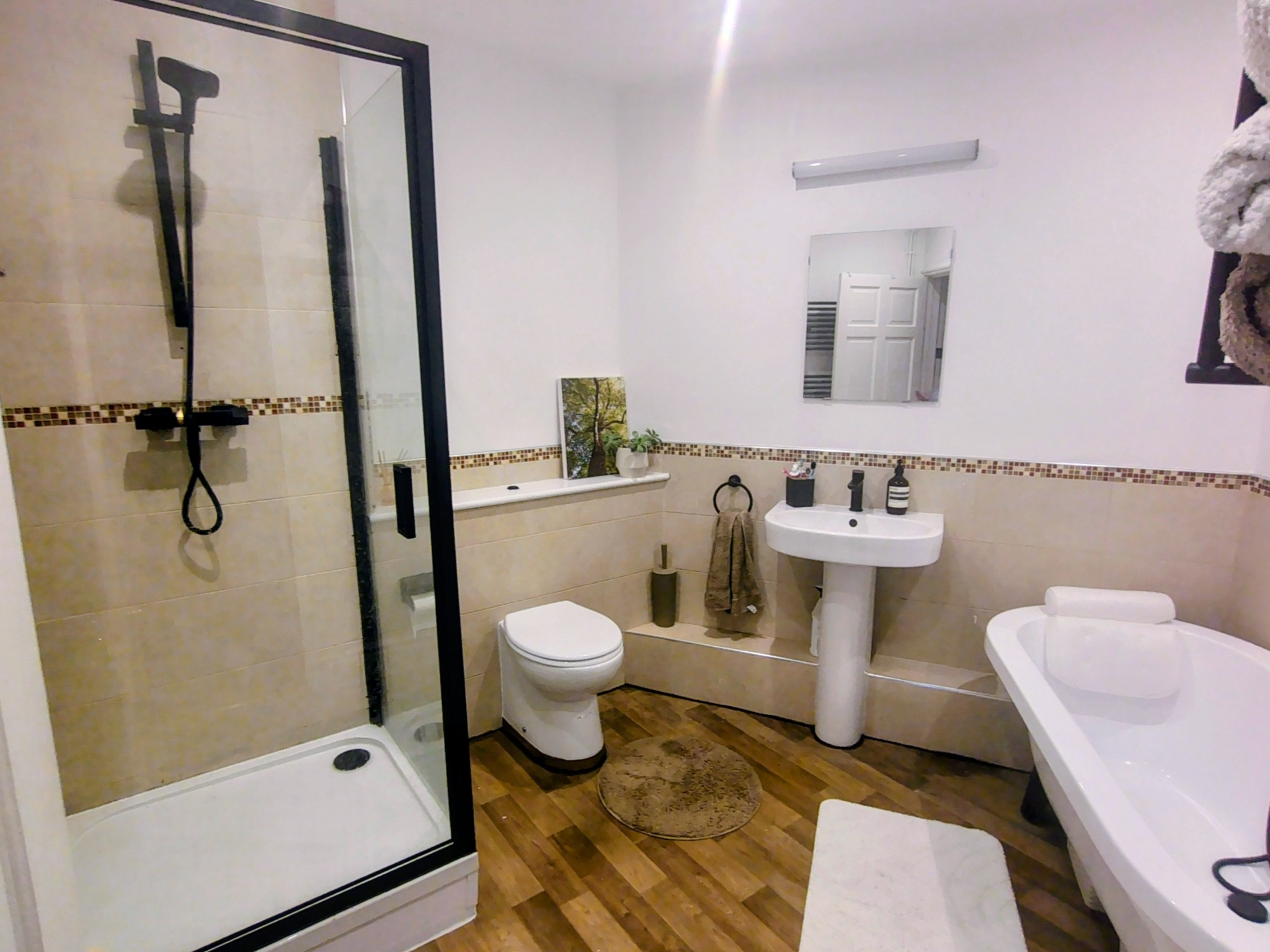 Large bathroom with separate walk-in shower and freestanding bath